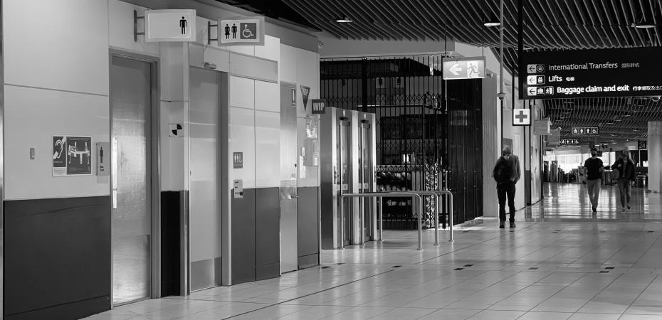Airport terminal showing bathrooms, one of which is accessible