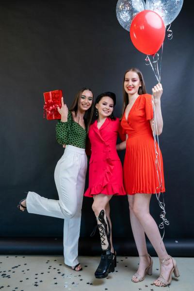 Photo by Mikhail Nilov: https://www.pexels.com/photo/a-three-women-holding-gift-and-balloons-9476067/