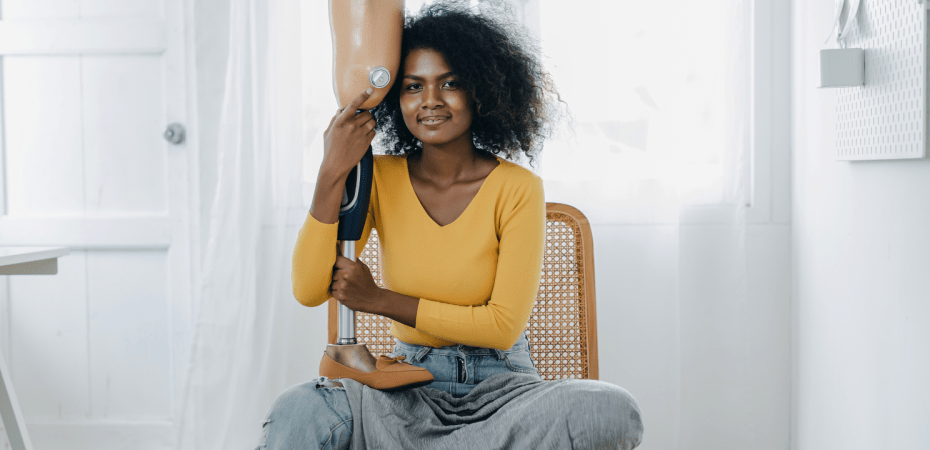 Woman hugs her prosthetic leg